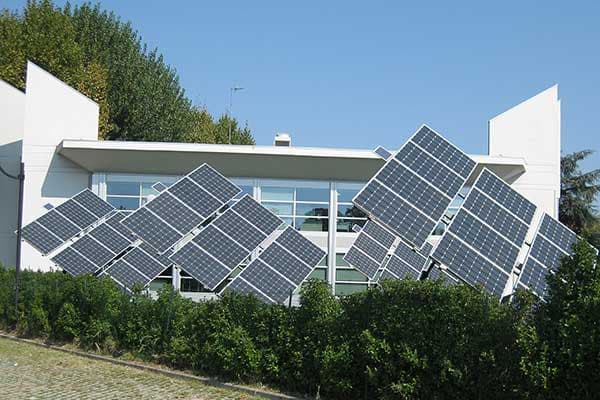 Array of modern solar panels on a commercial roof in Uttar Pradesh.